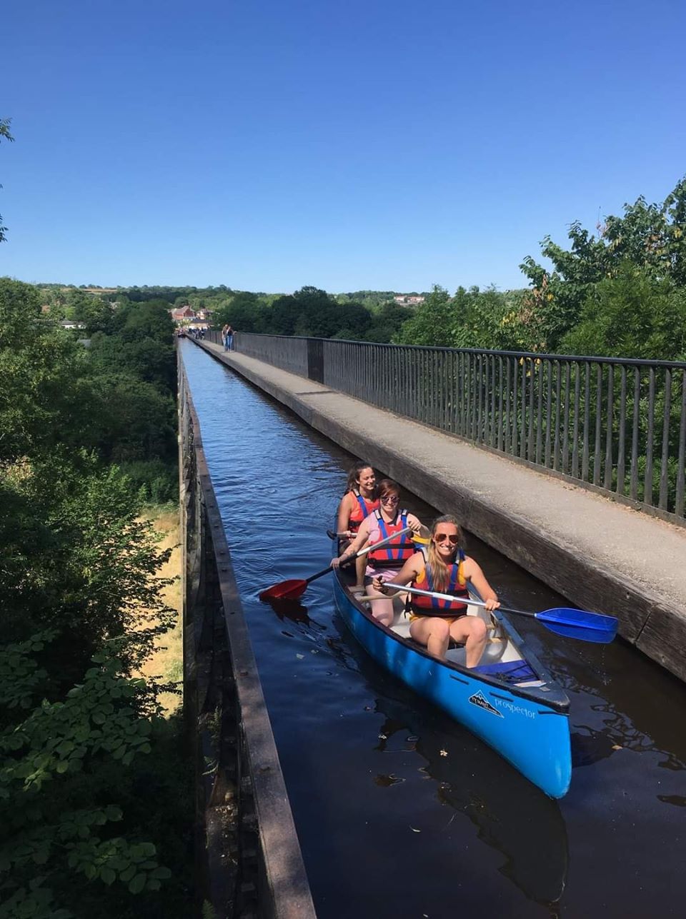 Paddlers in open canoe on the Pontycsyllte Aqueduct